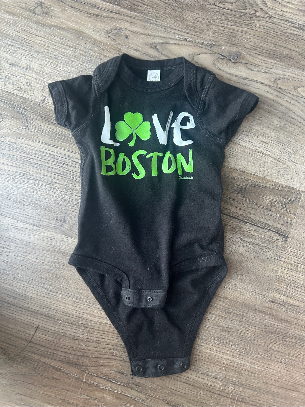 Rabbit Skins Black One-Piece Bodysuit with Green and White "Love Boston" Graphic